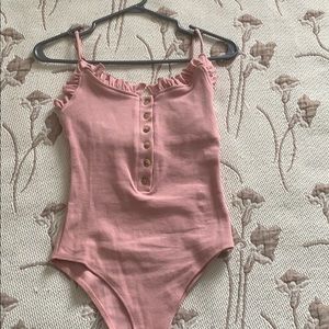 Pink body suit